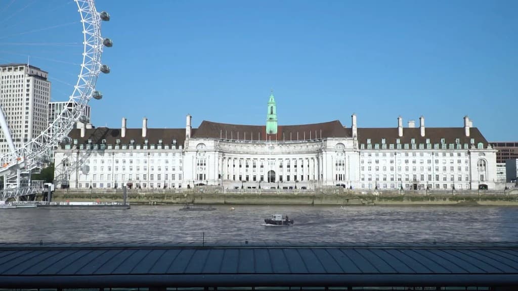 County Hall on the South Bank viewed from the River Thames, with the London Eye beside it