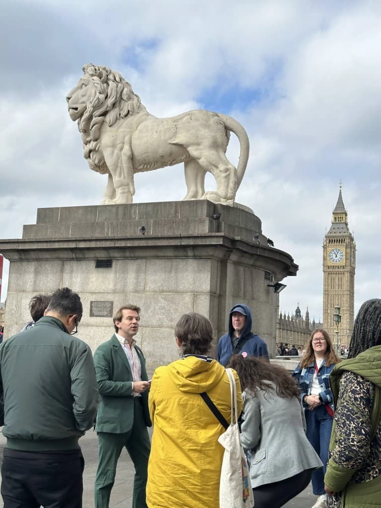 Guided tour near the South Bank Lion with Big Ben in the background